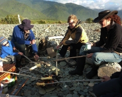 Cooking the damper bread. Barrytown, near Punakaiki